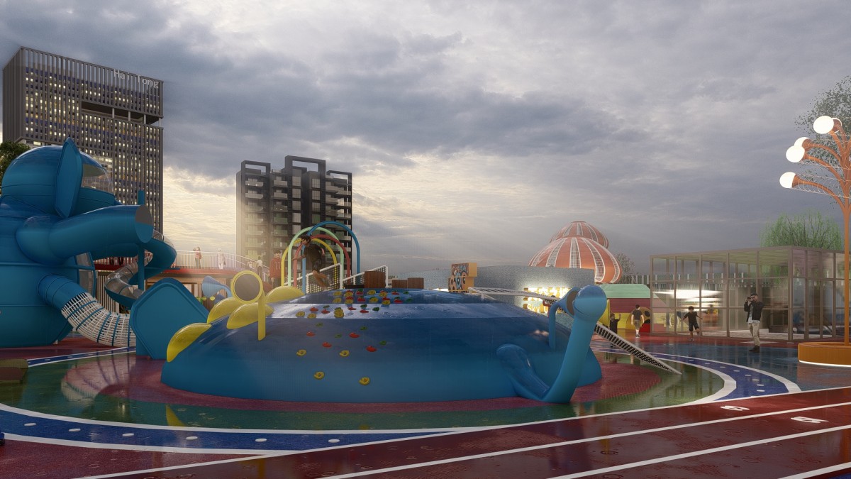 rooftop playground with a blue climbing island, tube slide and wet reflective coloured surfacing